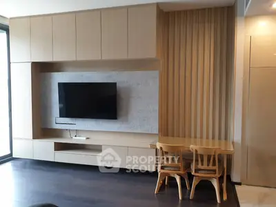Modern living room with sleek wooden furniture and mounted TV, perfect for stylish urban living.