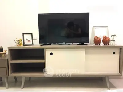 Modern living room with stylish TV stand and decor accents