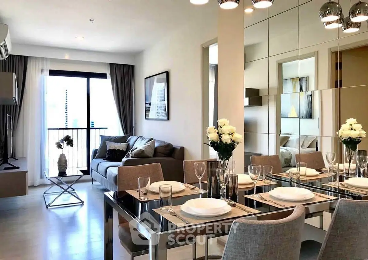 Modern living and dining area with elegant decor and natural light