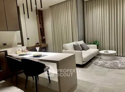 Modern living room with elegant decor and open dining area