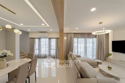 Spacious modern living room with elegant decor and ample natural light