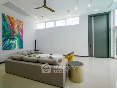 Spacious modern living room with abstract art and stylish furniture