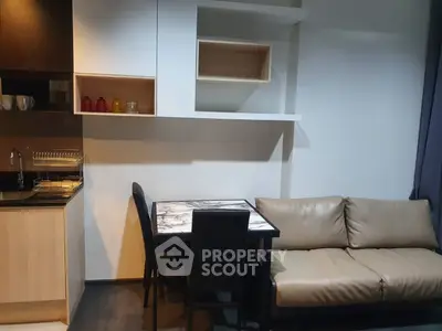 Modern apartment interior with sleek kitchen and cozy living area