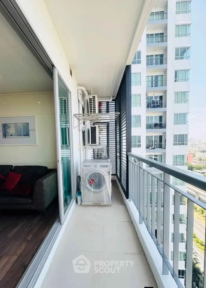 Modern apartment balcony with city view and air conditioning unit