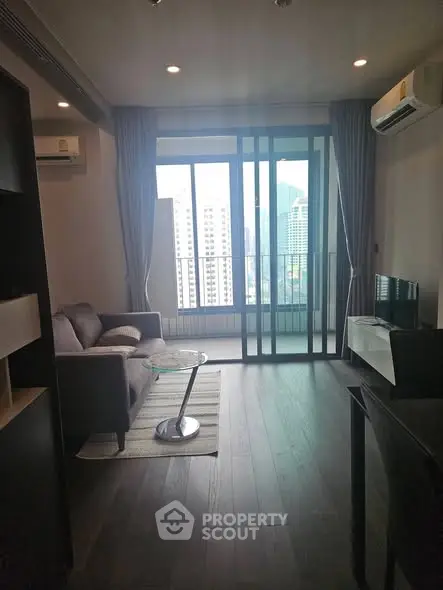 Modern living room with city view and sleek furnishings