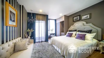 Luxurious modern bedroom with elegant decor and plush bedding in a stylish apartment.