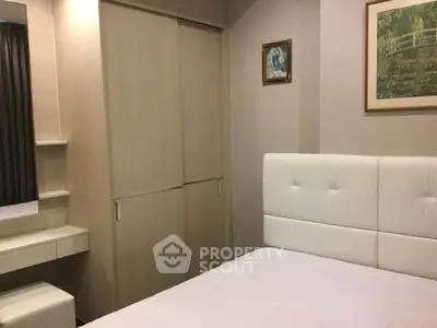 Cozy bedroom with modern decor and ample storage space