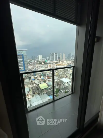 Stunning cityscape view from a modern high-rise balcony, perfect for urban living.