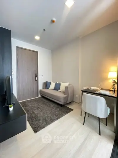 Modern living room with cozy sofa and stylish workspace