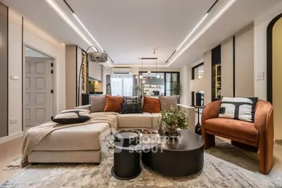Luxurious modern living room with stylish furniture and elegant decor, perfect for sophisticated urban living.