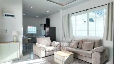 Spacious living room with cozy furniture and natural light in modern home