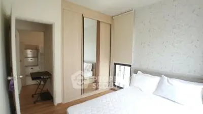 Cozy bedroom with mirrored wardrobe and natural light