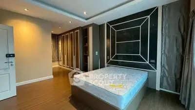 Spacious bedroom with modern design and ample closet space