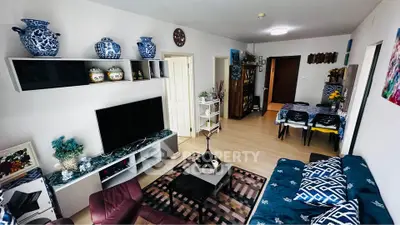 Spacious living room with modern decor and dining area in open layout.