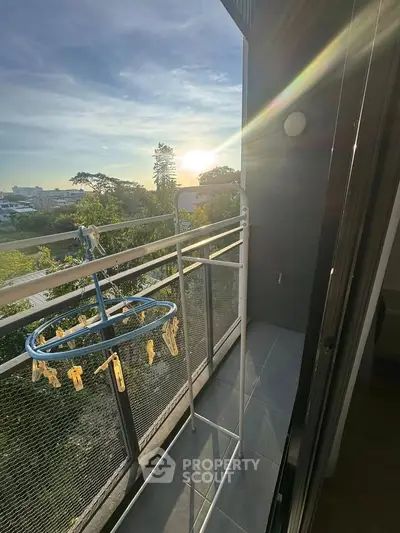 Charming balcony with scenic view and ample sunlight, perfect for relaxation and enjoying the outdoors.