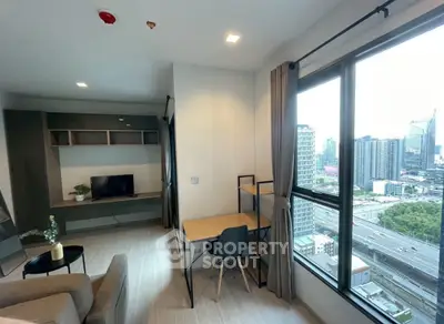 Modern living room with city view and workspace in high-rise apartment