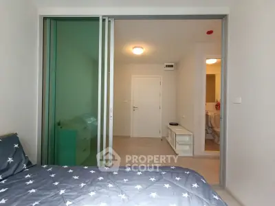 Modern bedroom with sliding glass doors and stylish decor
