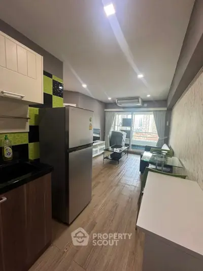Modern kitchen with open layout and city view, featuring sleek appliances and stylish decor.