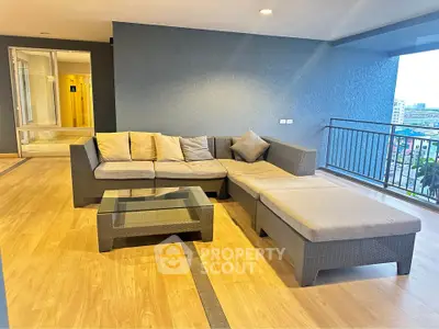 Spacious balcony with modern outdoor seating and city view