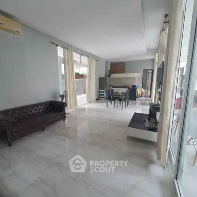 Spacious modern living room with elegant marble flooring and open layout