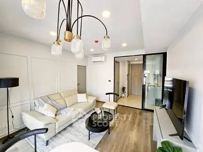 Modern living room with elegant lighting and stylish decor