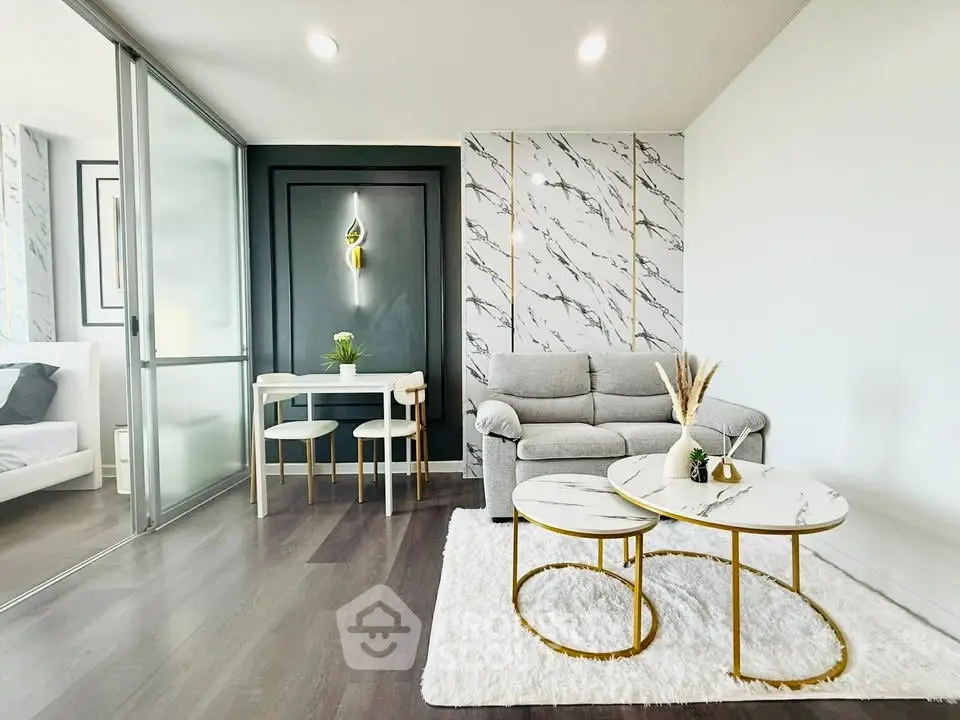 Modern living room with marble accents and stylish furniture in a contemporary apartment.