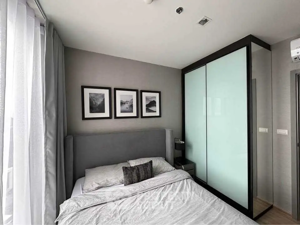 Modern bedroom with stylish decor and large wardrobe