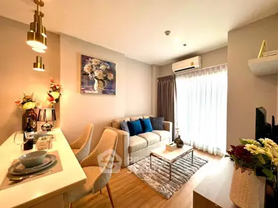 Chic modern living room with cozy seating and elegant decor, perfect for relaxation and entertaining.