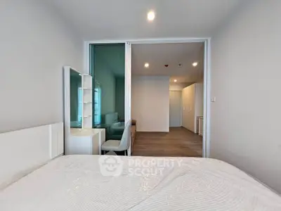 Modern bedroom with sliding glass doors and stylish decor