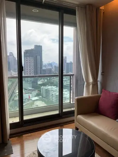 Stunning city view from modern high-rise apartment living room with large windows.