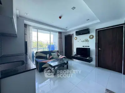 Modern living room with sleek design, large windows, and stylish decor in a contemporary apartment.