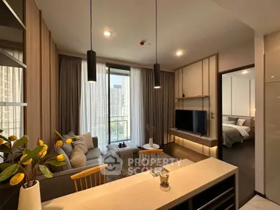 Modern open-layout living room with kitchen, featuring stylish decor and city view from large windows.