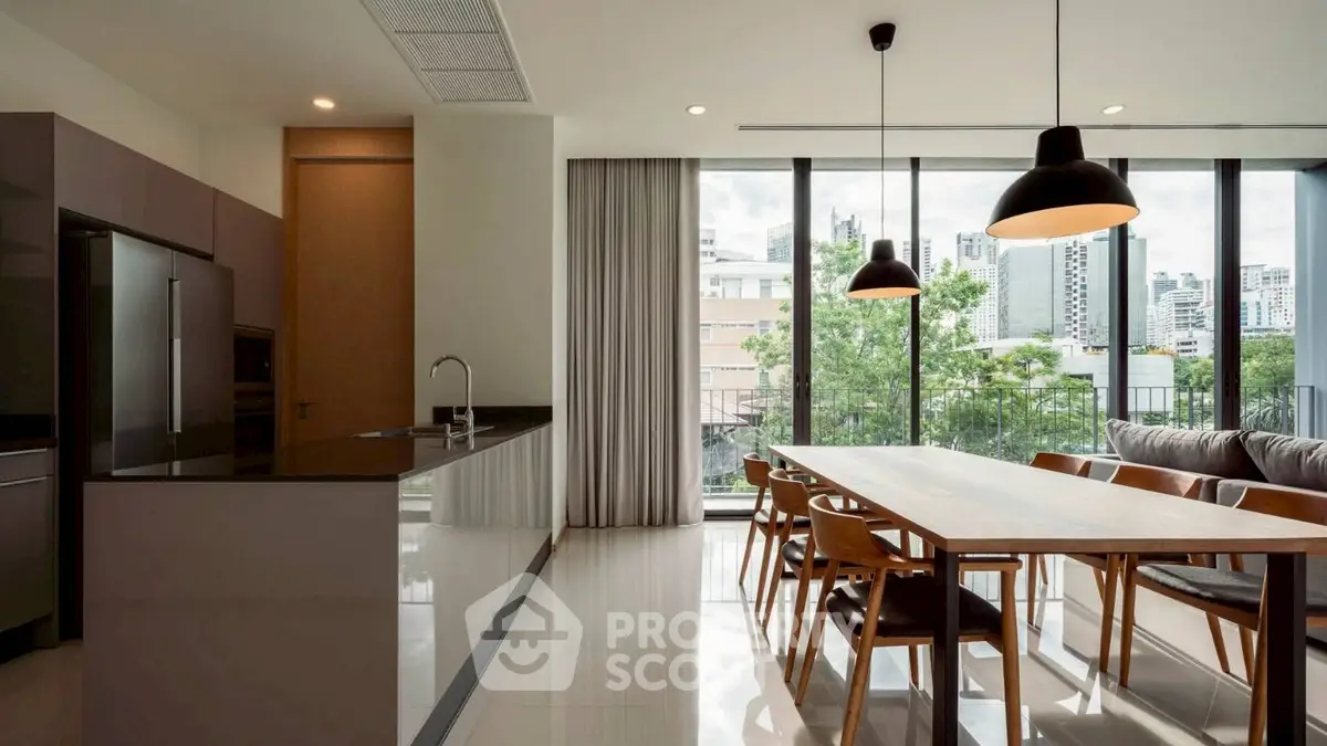 Modern kitchen and dining area with city view and sleek design.