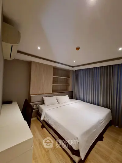 Cozy bedroom with modern design and ample natural light