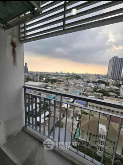 Stunning high-rise balcony view overlooking cityscape with expansive skyline.