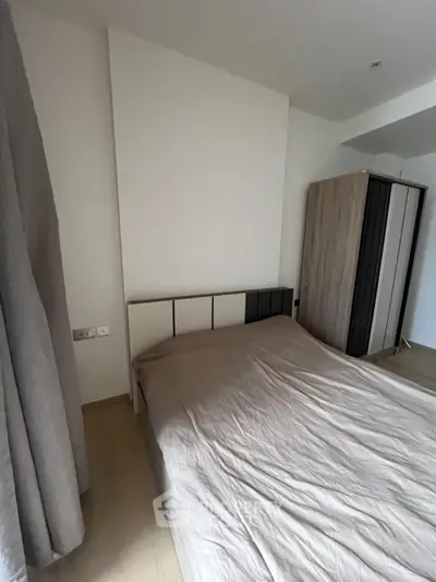 Cozy bedroom with modern wardrobe and neutral decor