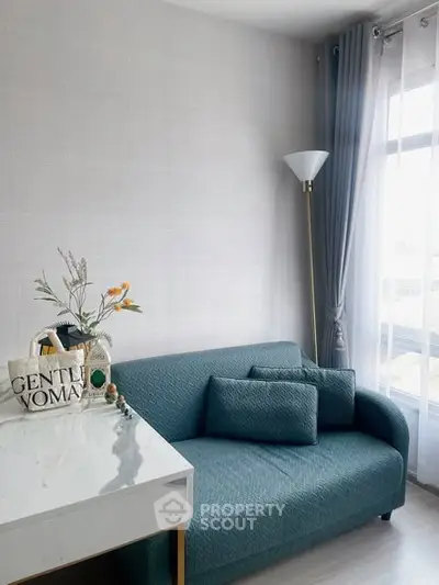 Modern living room with stylish sofa and natural light