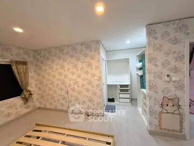 Spacious bedroom with floral wallpaper and built-in closet in modern apartment