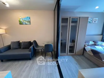 Modern studio apartment with cozy living area and stylish bedroom