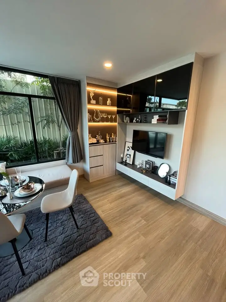 Modern living room with stylish decor and large window view