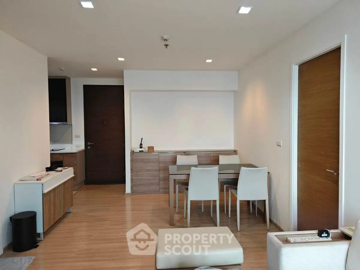 Modern dining area with sleek furniture and wooden flooring