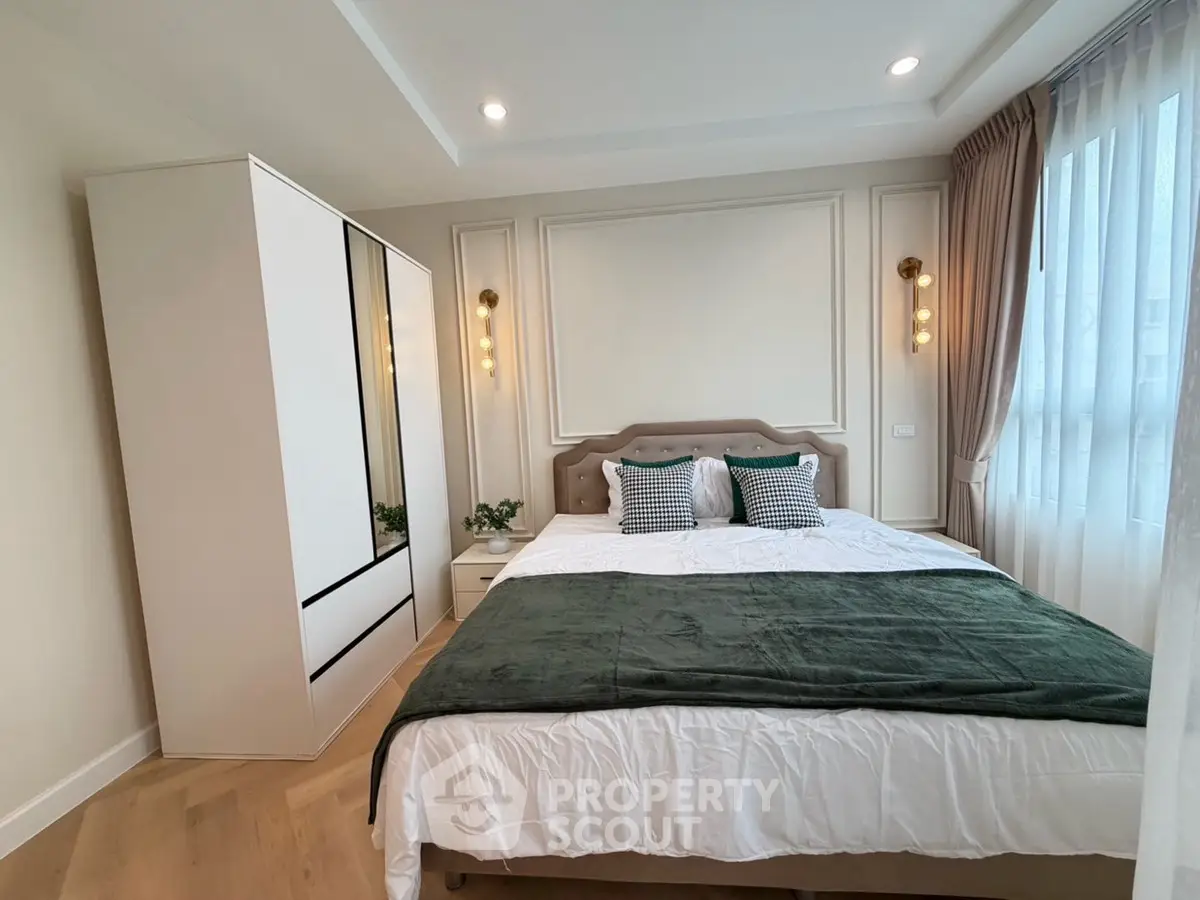 Elegant bedroom with stylish decor and natural light