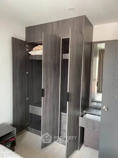 Modern bedroom with sleek built-in wardrobe and minimalist design