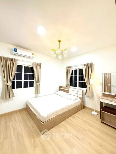 Bright and cozy bedroom with modern furnishings and natural light