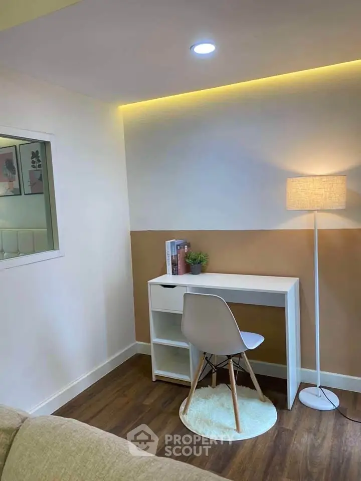 Cozy study nook with modern desk and chair, perfect for productivity.