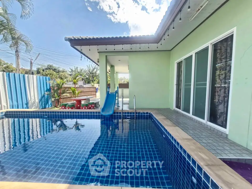 Charming home with private pool and slide, perfect for family fun and relaxation.