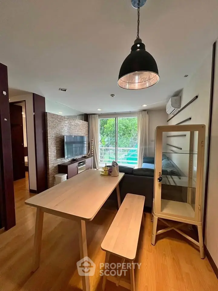Modern living room with dining area and large window view