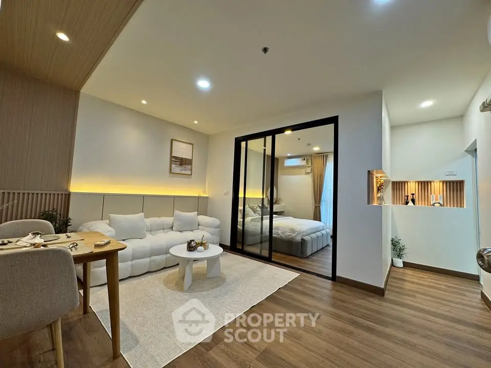 Modern open-plan living room with cozy seating and elegant decor