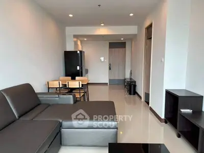 Modern living room with sleek furniture and open layout in a contemporary apartment.