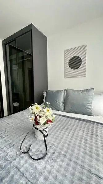 Elegant bedroom with modern decor and cozy bedding